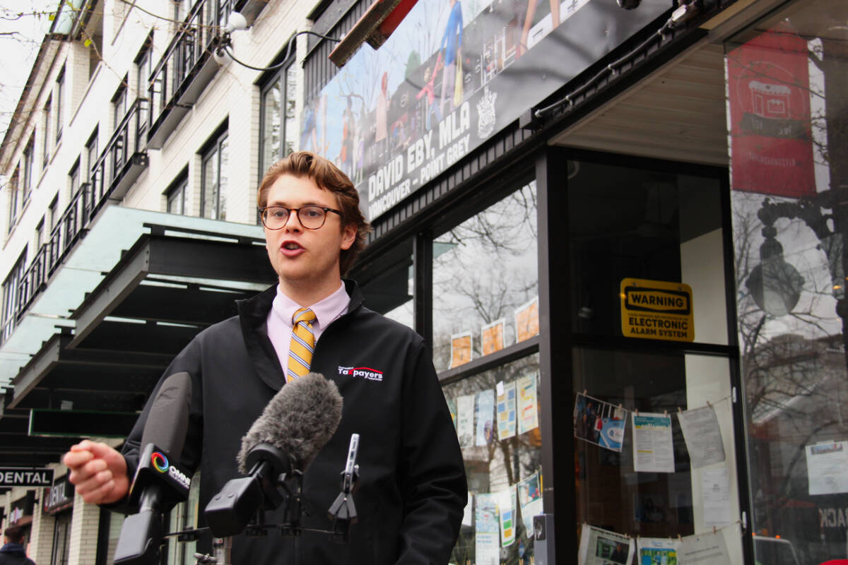 Carson Binda, the B.C. director of the Canadian Taxpayers Federation, stood outside Premier David Eby’s constituency office in Vancouver on March 21, 2024, demanding that he oppose the upcoming carbon tax hike. (Jane Skrypnek/Black Press Media)