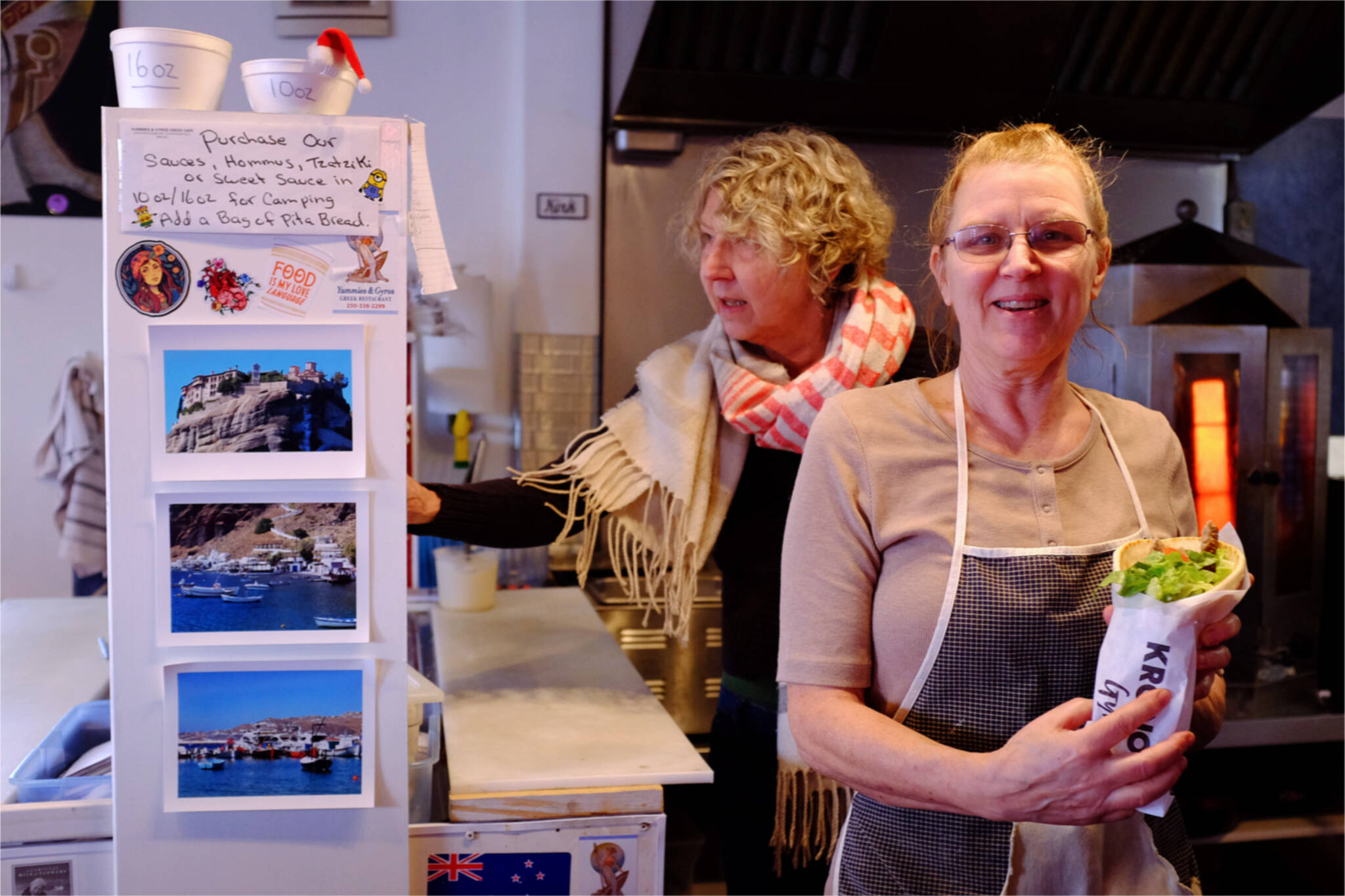 Katherine Kirk (front), owner of Yummies & Gyros Greek Cafe, started a pay-it-forward promotion to help those in need on April 8. (Olivier Laurin / Comox Valley Record)