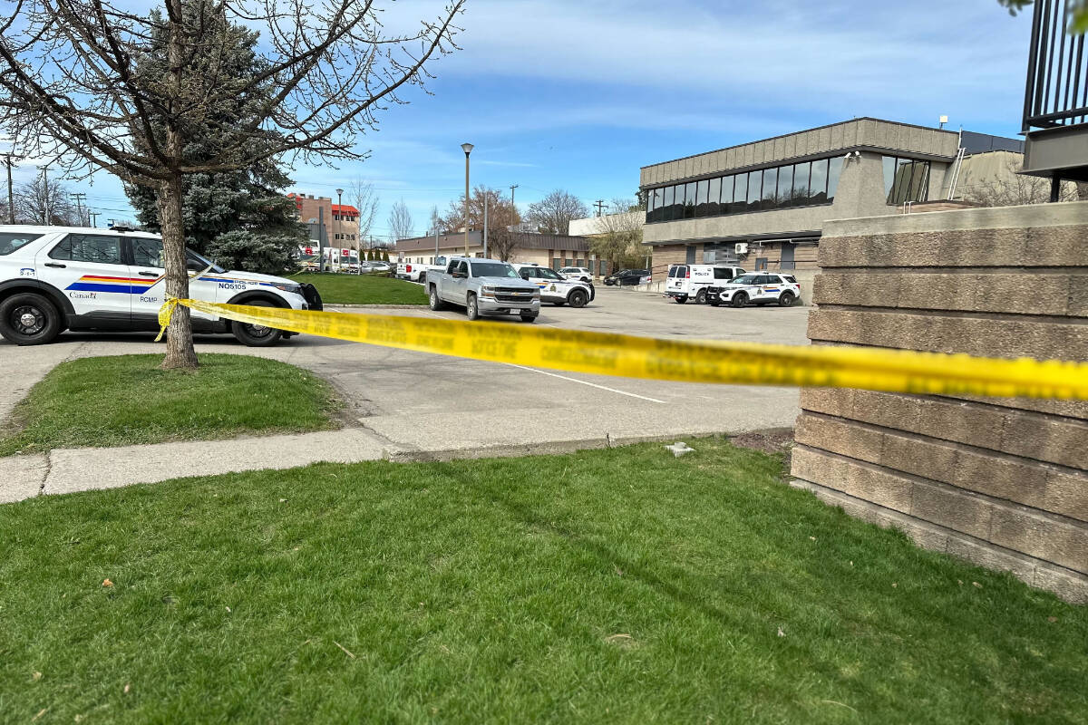 Police tape circles the Vernon North Okanagan RCMP detachment Wednesday afternoon as a precaution after a possible explosive device was brought in. (Bowen Assman - Morning Star)