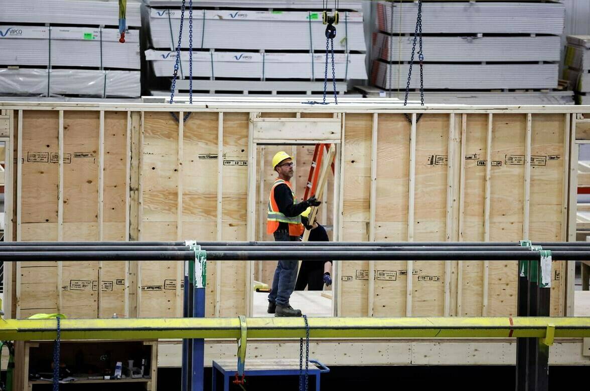An employee works on a modular home component at NRB Modular Solutions in Calgary, Friday, April 5, 2024. The Canadian government will allow 30-year amortization periods on insured mortgages for first-time homebuyers purchasing newly built homes. THE CANADIAN PRESS/Jeff McIntosh