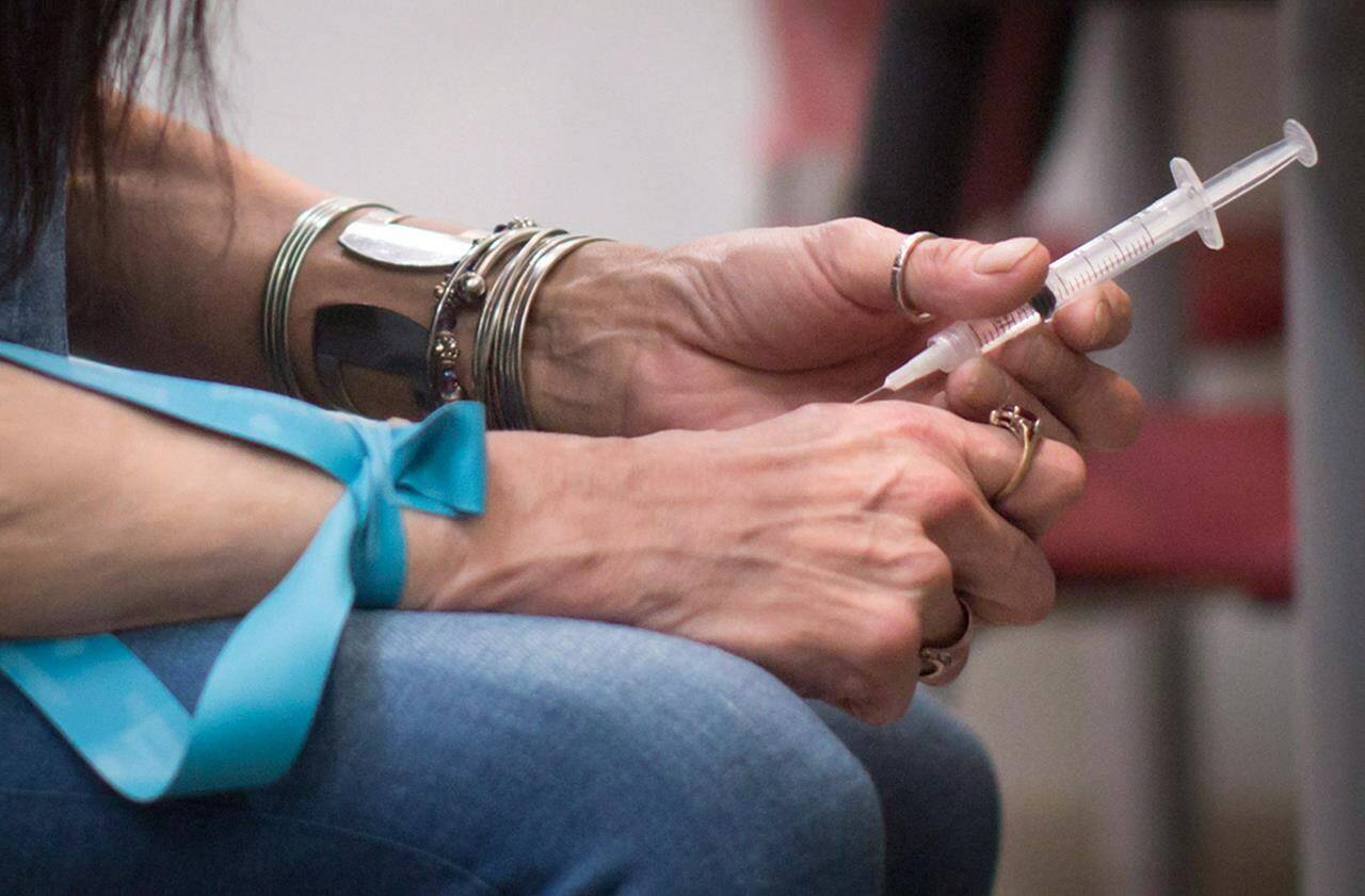 A woman injects hydromorphone at the Providence Health Care Crosstown Clinic in the Downtown Eastside of Vancouver, B.C., on Wednesday April 6, 2016. Peer-reviewed research into British Columbia’s safer drug supply program is emerging, with two studies in international medical journals casting the strategy in different light. THE CANADIAN PRESS/Darryl Dyck