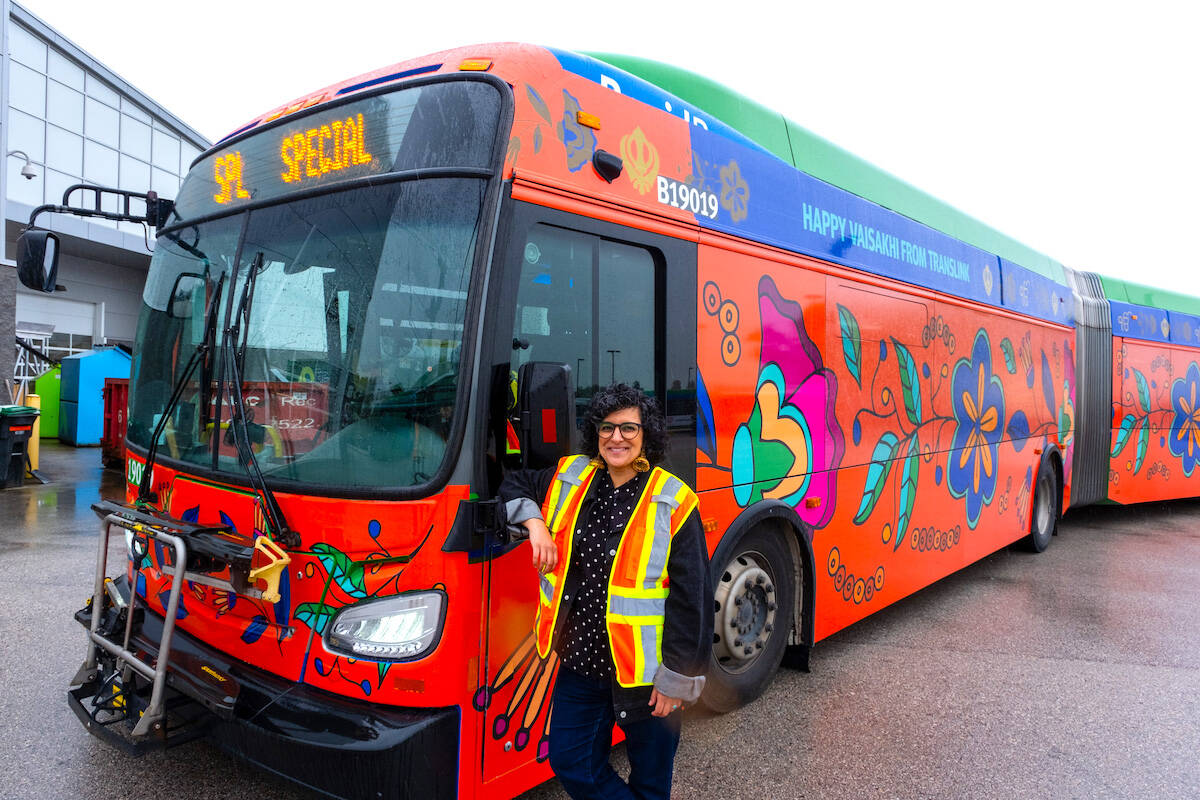 Artist Jag Nagra with TransLink bus wrapped with her Vaisakhi-themed artwork. (Contributed photo)