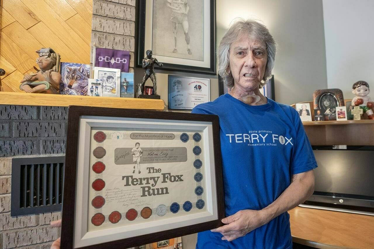 Eddy Nolan, who has run in a Terry Fox marathon each year for 46 years, is seen with some of his memorabilia, in Montreal, Tuesday, April 9, 2024. THE CANADIAN PRESS/Ryan Remiorz