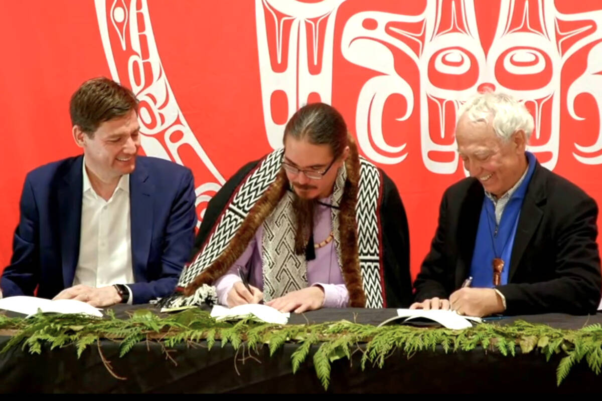 Premier David Eby, Haida Nation Council President Gaagwiis (Jason Alsop), Minister of Indigenous Relations and Reconciliation Murray Rankin and Haida Nation Council Vice-President Stephen Grosse (not pictured) signed the “Gaayhllxid/Gíihlagalgang ‘Rising Tide’ Haida Title Lands Agreement” in Haida Gwaii on April 14, 2024. (Government of B.C./YouTube)
