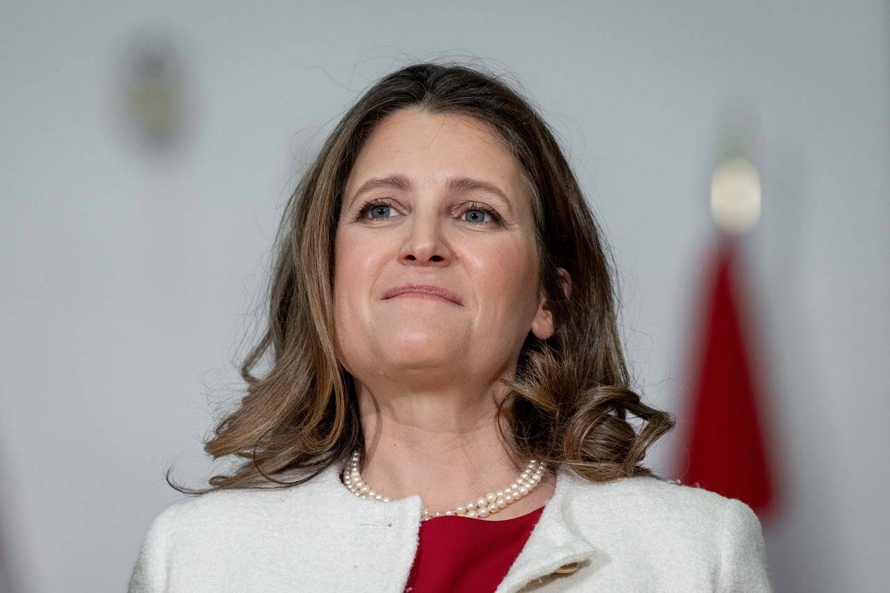 Finance Minister Chrystia Freeland listens to a speaker during a news conference in Vancouver on Wednesday, March 27, 2024. Freeland says Ottawa is setting up a $500-million fund to help community health organizations provide more mental health care to young people. THE CANADIAN PRESS/Ethan Cairns