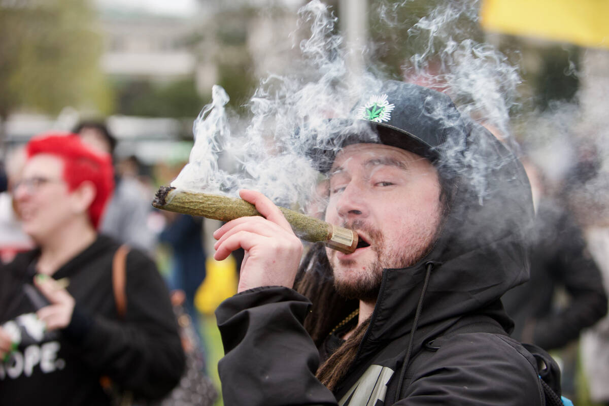Victoria has been named the dopest city in B.C. Pictured is a demonstrator taking a drag out of a large joint on April 20, 2022 during a 4/20 demonstration at the B.C. Legislature. (Justin Samanski-Langille/News Staff)