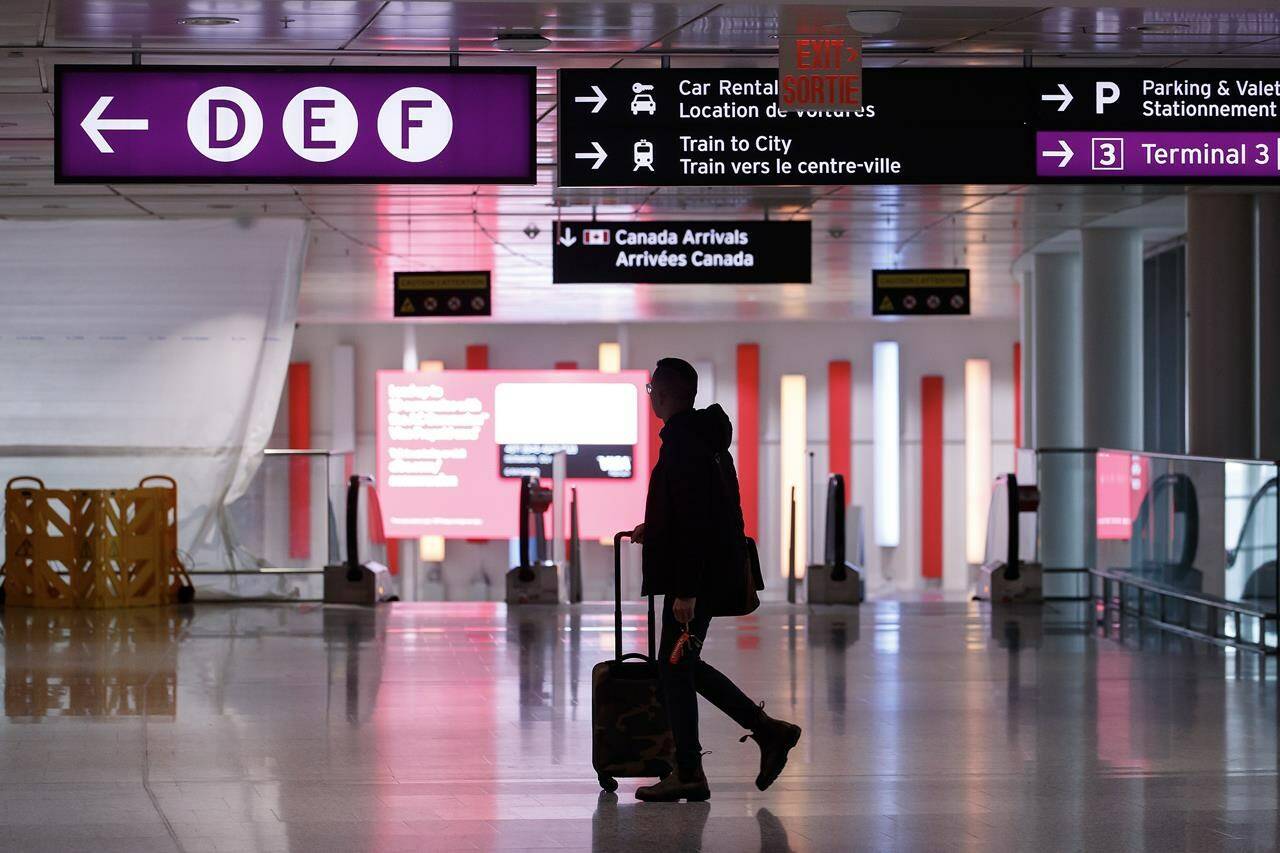More than 800 airline food service staff at Toronto’s Pearson airport have gone on strike, potentially leaving thousands of passengers without meals. Travellers make their way through Pearson International Airport in Toronto Monday, Nov. 14, 2022. THE CANADIAN PRESS/Cole Burston
