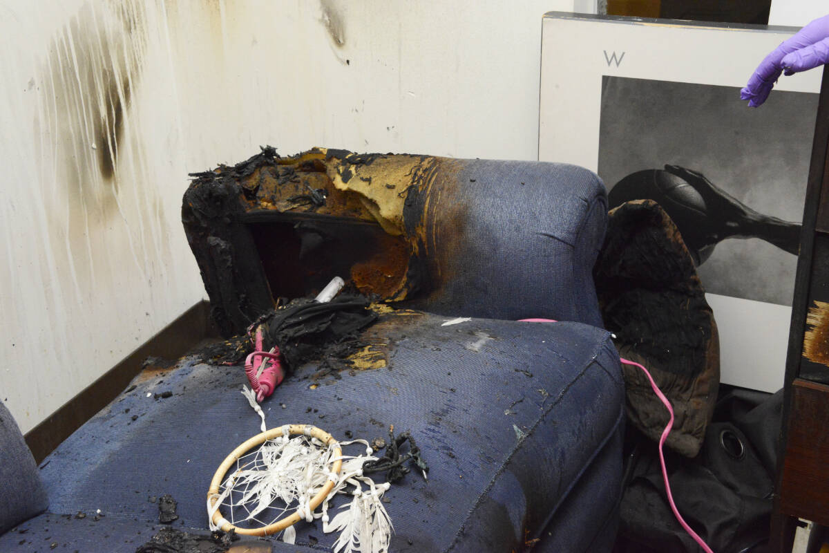 The couch from the apartment Lisa Rauch had barricaded herself into. A curling iron is shown sitting in the couch, possibly the cause of the fire that gave urgency to the police response, during which Rauch was killed. (Photo Courtesy of the Office of the Police Complaint Commissioner)