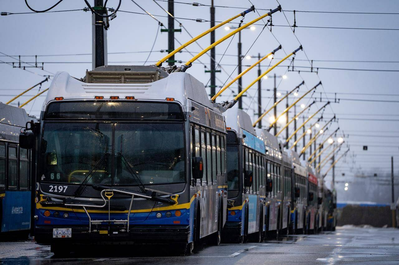 Buses line the Vancouver Transit Centre in Vancouver on Monday, Jan. 22, 2024. British Columbia is earmarking up to $300 million in new capital funding to help TransLink, Metro Vancouver’s transit provider, add more buses to its fleet. THE CANADIAN PRESS/Ethan Cairns