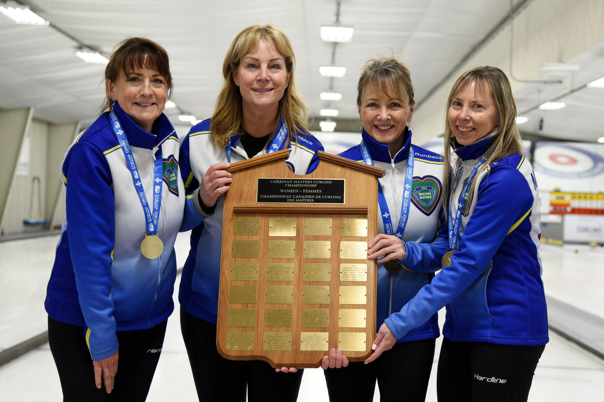 Cindy Curtain, left, Penny Shantz, Danielle Shaughnessy and Donna Mychaluk show the trophy thei won in Canadian women’s masters curling. (Contributed)