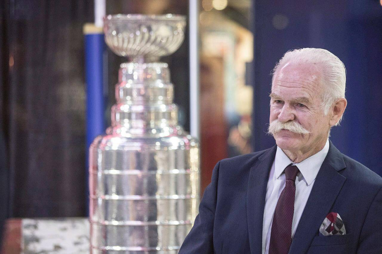 NHL Hall of famer Lanny McDonald is pictured near the Stanley Cup following a news conference in Toronto on Tuesday June 27, 2017. THE CANADIAN PRESS/Chris Young