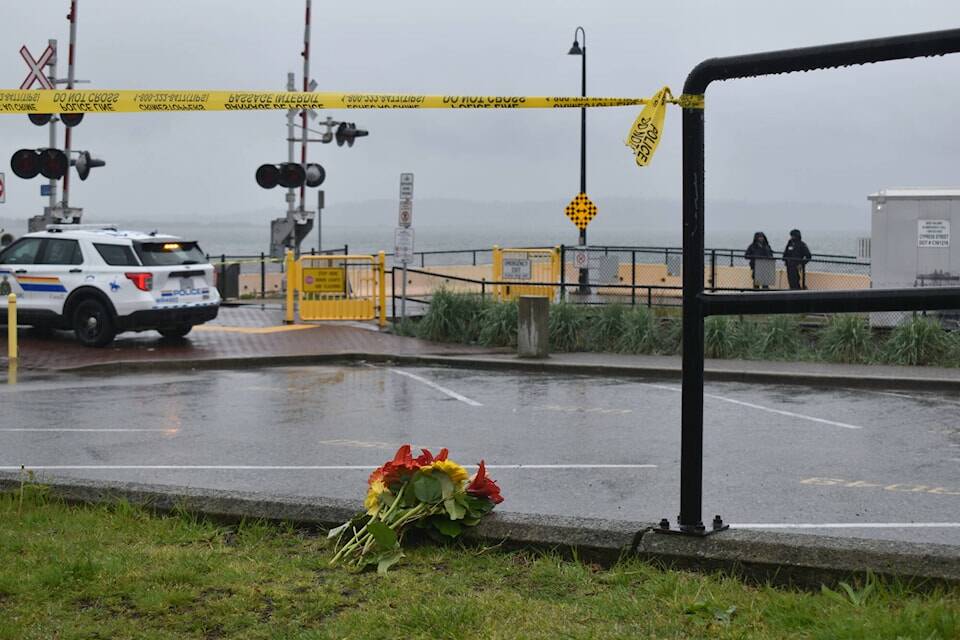 Flowers have been placed near the spot where a person was fatally stabbed Tuesday night on the White Rock waterfront. Tricia Weel photo