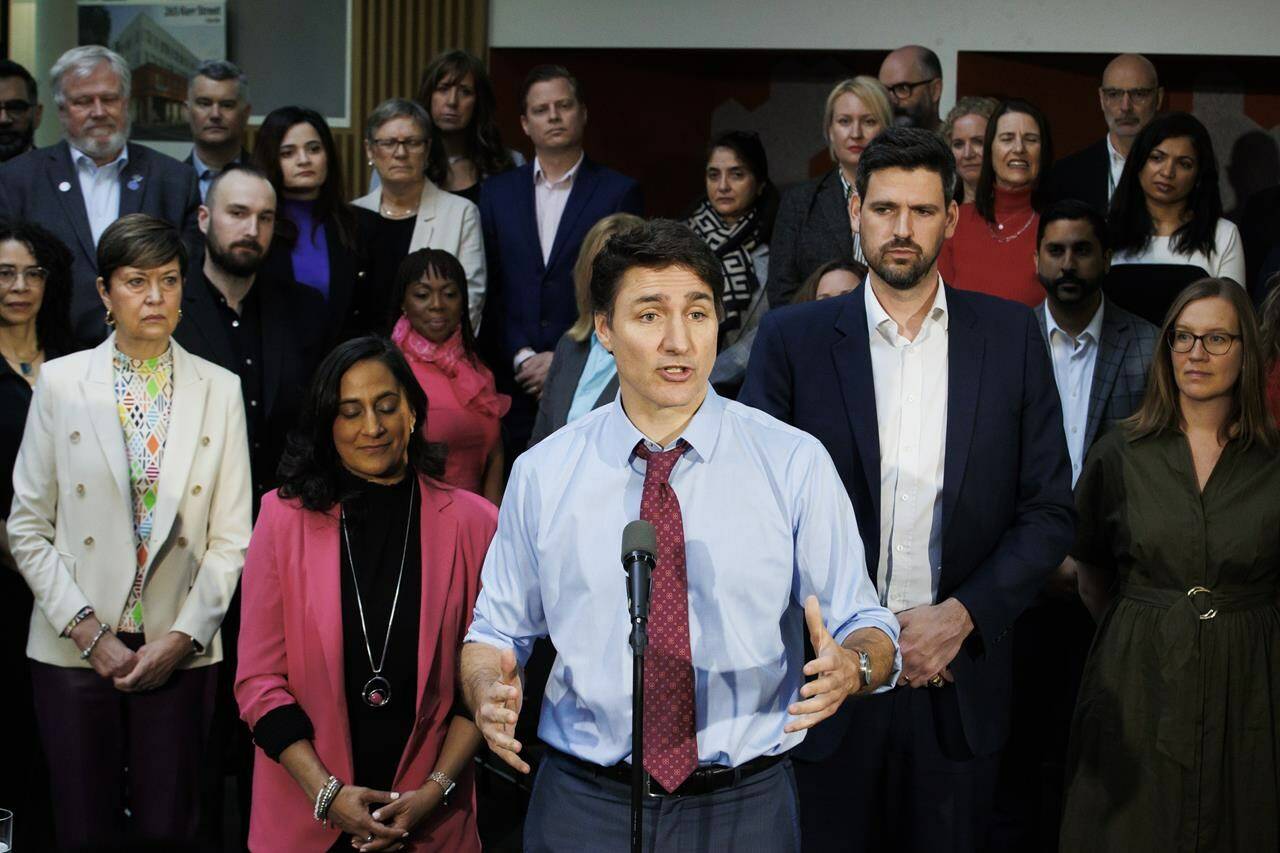 Prime Minister Justin Trudeau is flanked by Minister of Housing Sean Fraser, right, and Treasury Board President Anita Anand, left, during a press conference in Oakville, Ont., on Wednesday, April 24, 2024. Trudeau is ramping up his attacks on Conservative Leader Pierre Poilievre as he promotes the government’s federal budget. THE CANADIAN PRESS/Cole Burston