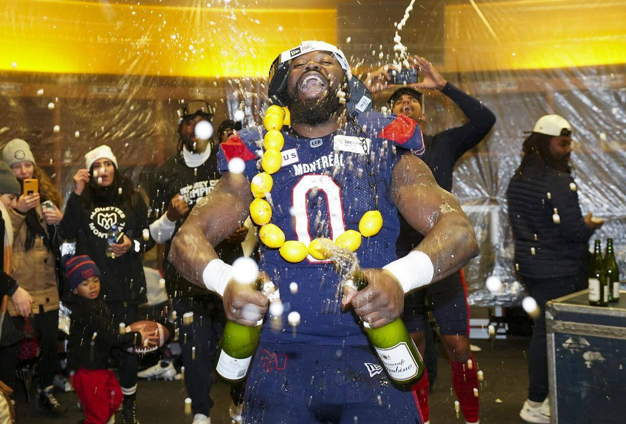 Montreal Alouettes defensive end Shawn Lemon (0) celebrates in the dressing room after the Alouettes defeated the Winnipeg Blue Bombers to win the 110th CFL Grey Cup in Hamilton, Ont., on Sunday, Nov.19, 2023. The CFL has suspended veteran defensive lineman Lemon indefinitely for betting on league games.Lemon, a three-time Grey Cup champion, retired April 10. THE CANADIAN PRESS/Nathan Denette