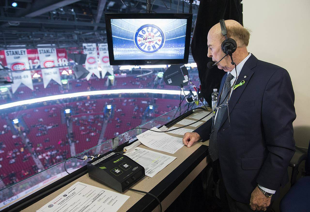 Legendary broadcaster Bob Cole looks out over the ice prior to calling his last NHL hockey game between the Montreal Canadiens and the Toronto Maple Leafs in Montreal, Saturday, April 6, 2019. Cole, a welcome voice for Canadian hockey fans for a half-century, has died at the age of 90. THE CANADIAN PRESS/Graham Hughes