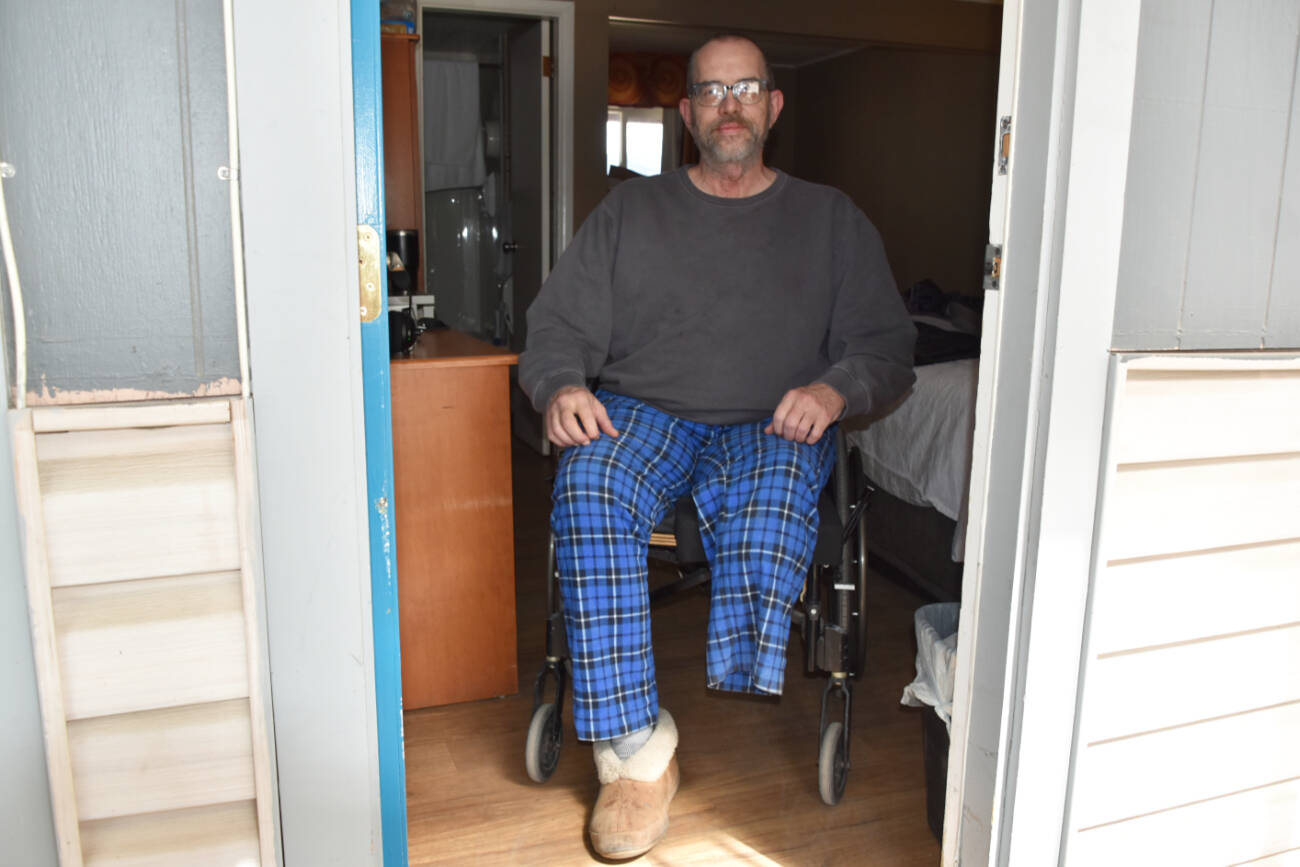 Displaced by the Bush Creek East wildfire, former North Shuswap resident LJ Folden sits in his room at the Sorrento Inn, where he’s able to stay until April 30 when the financial support he’s received since the fire comes to an end. (Heather Black-Salmon Arm Observer)