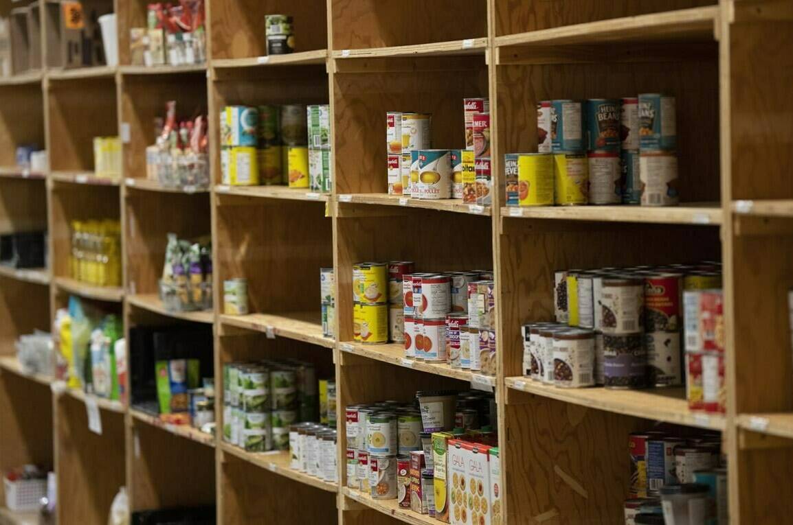 Canned products sit on shelves at a food bank in Ottawa, Friday, Oct. 7, 2022. Food Banks BC executive director Dan Huang-Taylor said that in March there were just under 98,000 people in B.C. accessing Food Banks BC’s 107 member organizations. It’s the highest Food Banks BC has seen, and a 30-per-cent increase from 2022. THE CANADIAN PRESS/Adrian Wyld