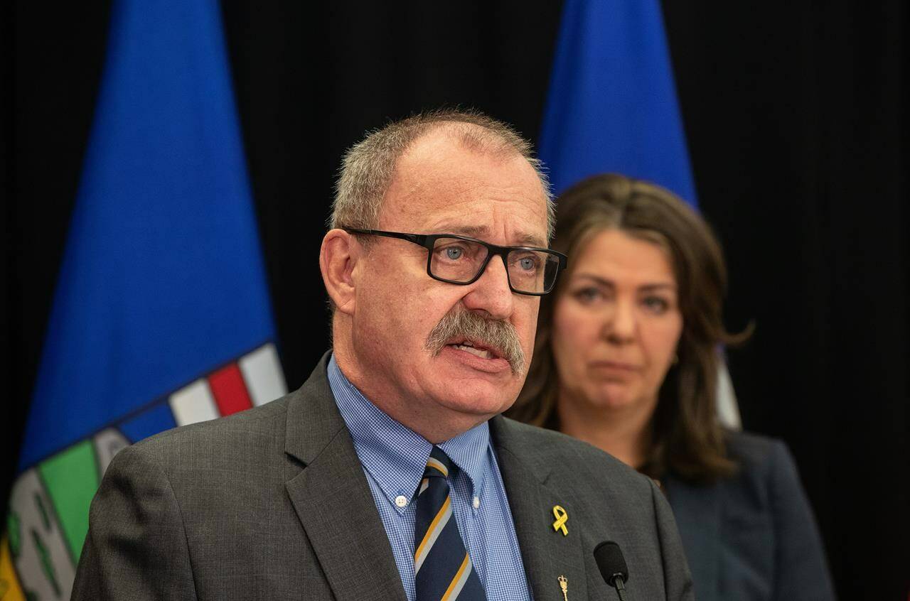 Minister of Municipal Affairs Ric McIver and Alberta Premier Danielle Smith introduce legislation addressing agreements between the federal government and provincial entities in Edmonton on April 10, 2024. THE CANADIAN PRESS/Jason Franson
