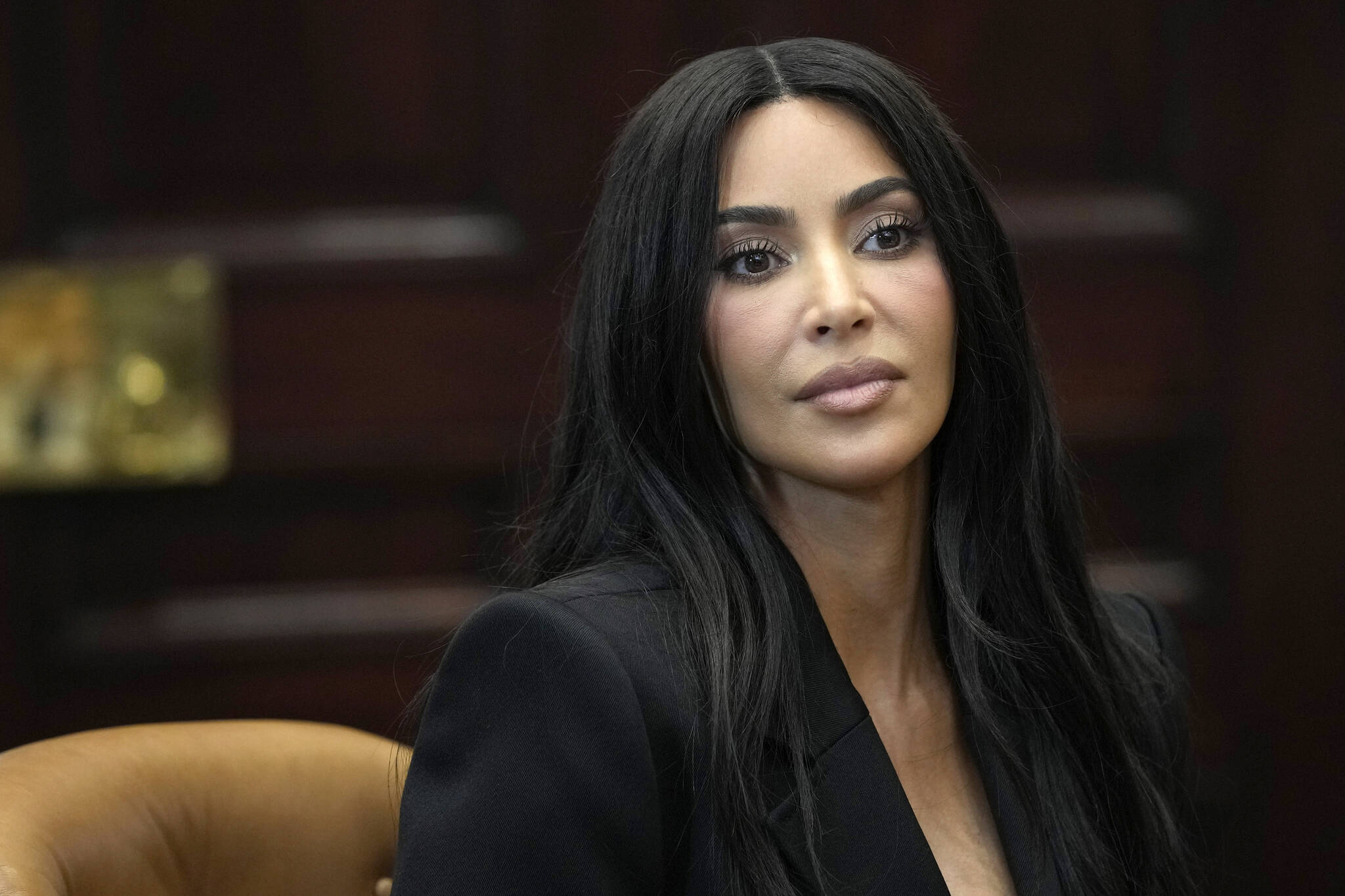 Kim Kardashian listens during a discussion in the Roosevelt Room of the White House in Washington, Thursday, April 25, 2024, on criminal justice reform and the pardons issued by President Joe Biden earlier this month. (AP Photo/Susan Walsh)