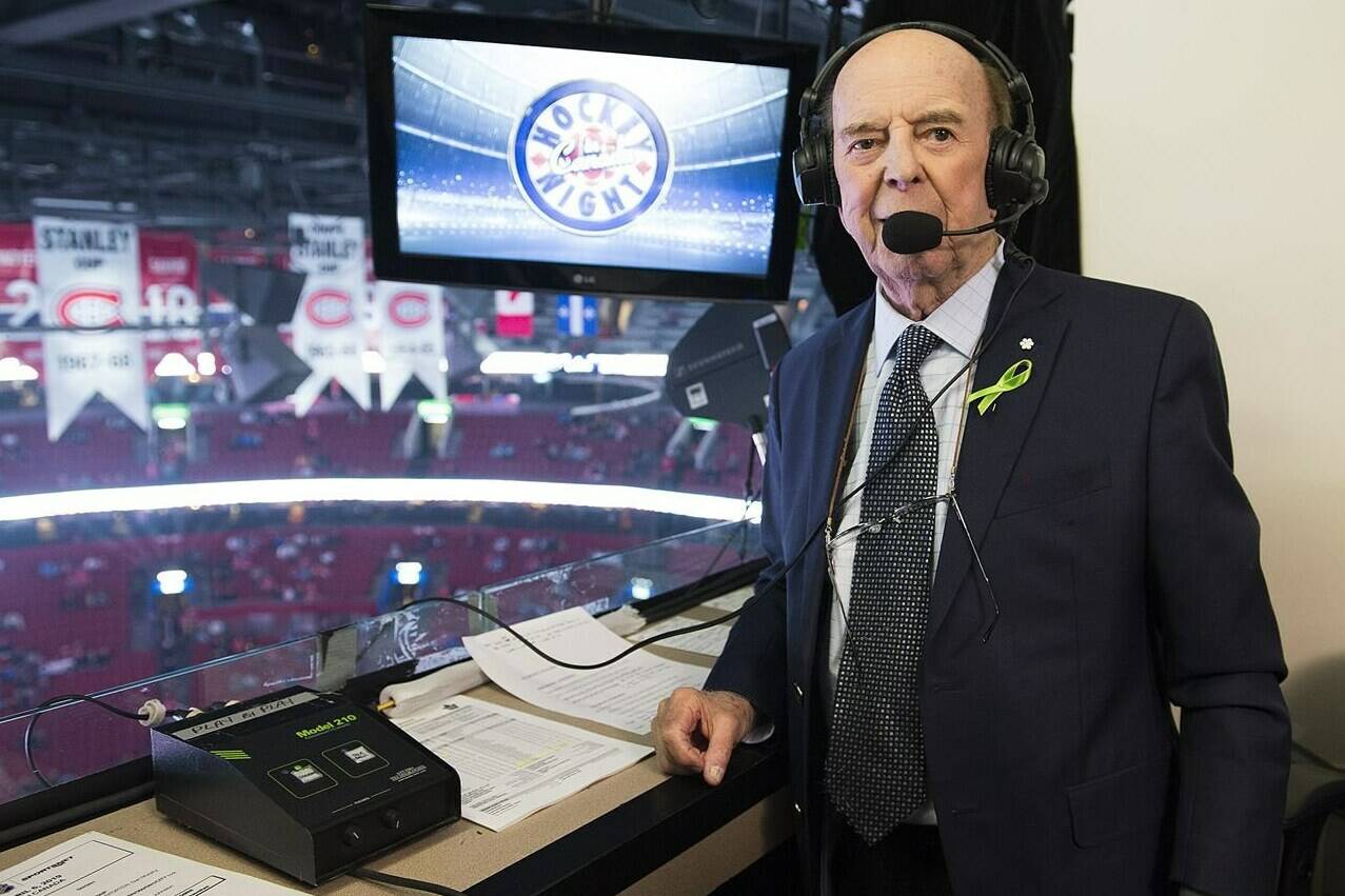 Legendary broadcaster Bob Cole poses before calling his last NHL hockey game between the Montreal Canadiens and the Toronto Maple Leafs in Montreal, Saturday, April 6, 2019. Broadcaster Cole, a welcome voice for Canadian hockey fans for a half-century, has died at the age of 90. THE CANADIAN PRESS/Graham Hughes