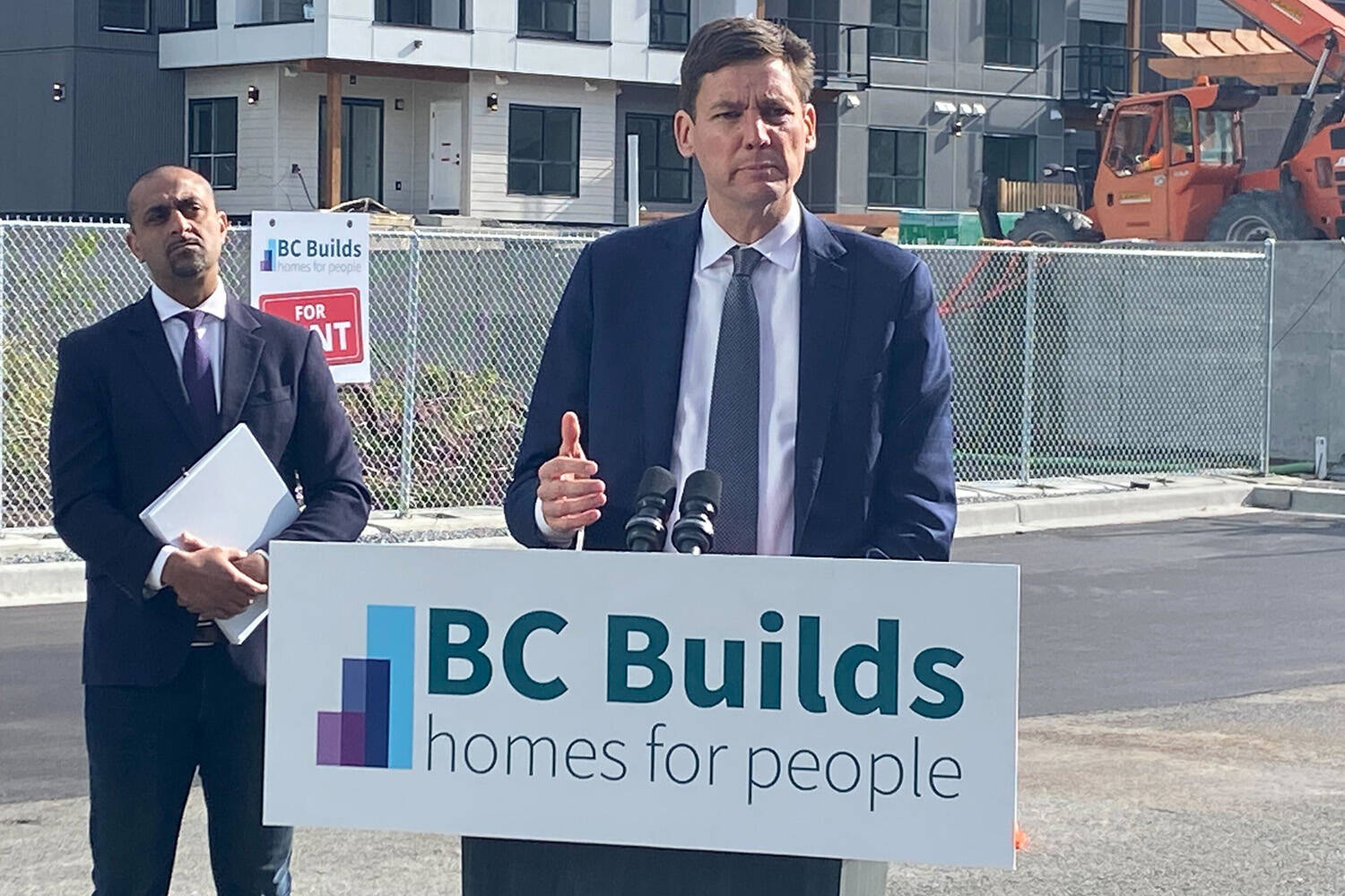 Housing Minister Ravi Kahlon listens as Premier David Eby Monday (April 29) announces eight new B.C. Builds sites across B.C. including three in the Township of Langley. (Matthew Claxton/Langley Advance-Times)