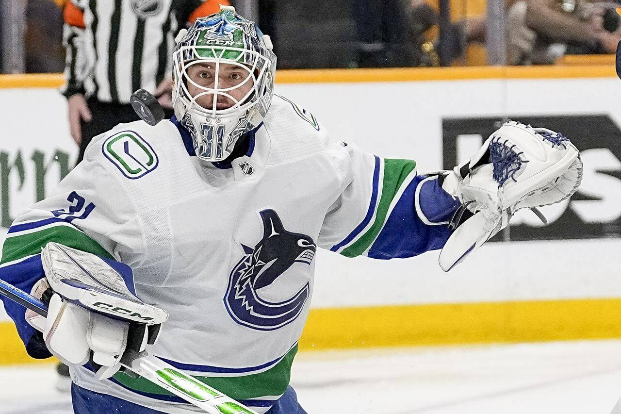 Vancouver Canucks goaltender Arturs Silovs (31) blocks a shot on goal against the Nashville Predators during the second period in Game 4 of an NHL hockey Stanley Cup first-round playoff series Sunday, April 28, 2024, in Nashville, Tenn. THE CANADIAN PRESS/AP-George Walker IV