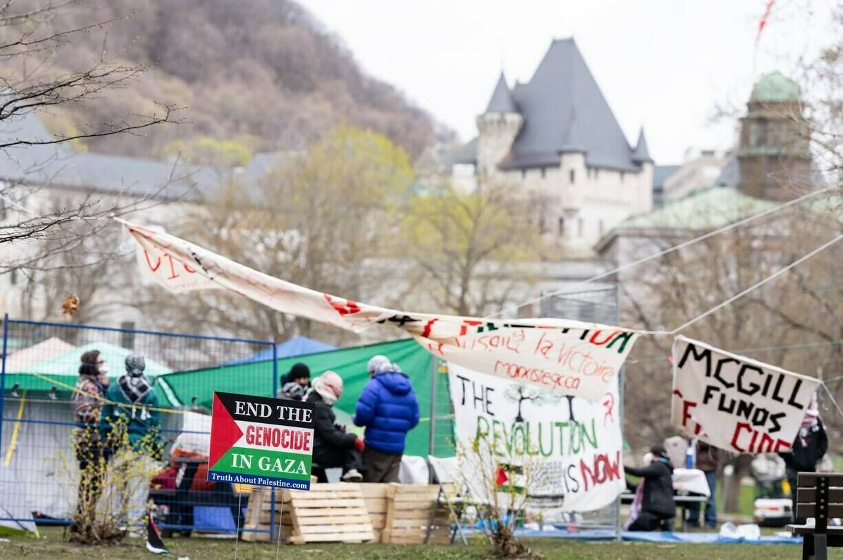 Pro-Palestinian activists are seen in their encampment set up on McGill University’s campus in Montreal, Monday, April 29, 2024. The university says it will make efforts to de-escalate before asking for police help with a camp that’s been set up on campus by pro-Palestinian activists. THE CANADIAN PRESS/Christinne Muschi