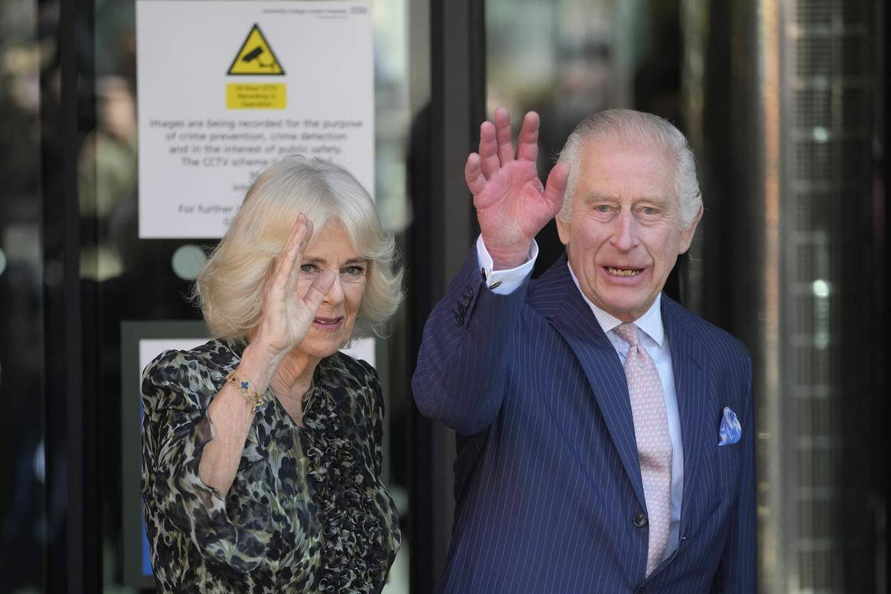 Britain’s King Charles III and Queen Camilla wave as they arrive for a visit to University College Hospital Macmillan Cancer Centre in London, Tuesday, April 30, 2024. The King, Patron of Cancer Research UK and Macmillan Cancer Support, and Queen Camilla visited the University College Hospital Macmillan Cancer Centre, meeting patients and staff. This visit is to raise awareness of the importance of early diagnosis and will highlight some of the innovative research, supported by Cancer Research UK, which is taking place at the hospital. (AP Photo/Kin Cheung)