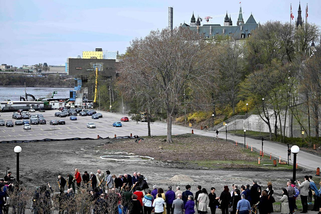 The future site of Thunderhead: Canada’s 2SLGBTQI+ National Monument is marked out in the dirt by a translucent ring behind political leaders and members of the LGBT Purge Fund as they participate in a ground breaking ceremony in Ottawa, on Wednesday, May 1, 2024. THE CANADIAN PRESS/Justin Tang