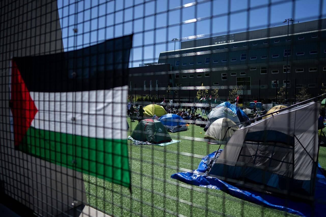 Pro-Palestinian protesters have set up camp at a second university in British Columbia, days after the first one was erected at a Vancouver campus. People take over a field with tents during a student encampment for Palestine at the University of British Columbia campus in Vancouver, B.C., Monday, April. 29, 2024. THE CANADIAN PRESS/Ethan Cairns