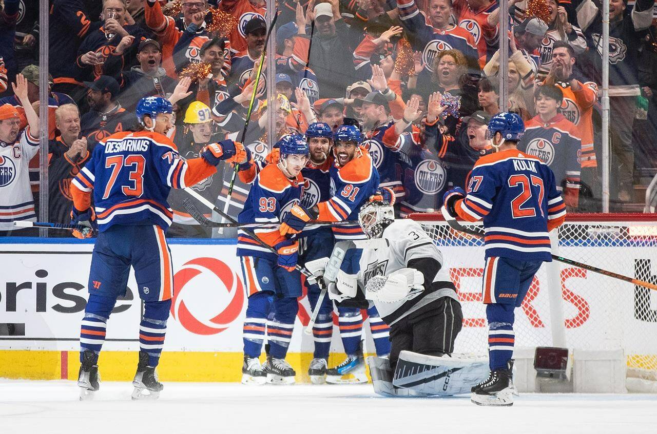 Los Angeles Kings goalie David Rittich (31) looks on as Edmonton Oilers’ Vincent Desharnais (73), Ryan Nugent-Hopkins (93), Leon Draisaitl (29), Evander Kane (91) and Brett Kulak (27) celebrate a goal during first period NHL playoff action in Edmonton on Wednesday May 1, 2024.THE CANADIAN PRESS/Jason Franson