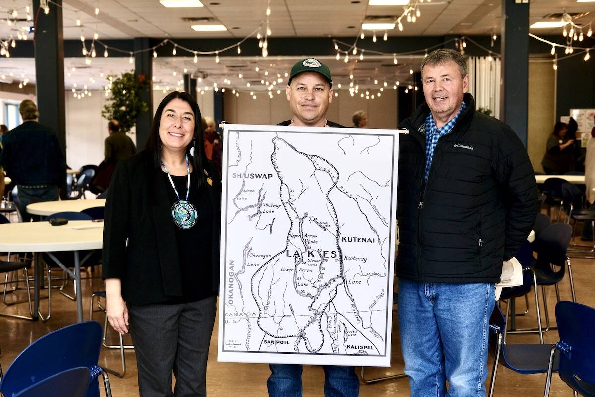 Sinixt Confederacy staff members Cindy Marchand, Herb Alex, and Joe Peone at the Sinixt educational event in Nelson on April 27 with a map showing the area that the Sinixt (shown on the map as the Lakes people) consider their territory in Canada.The map was made by the anthropologist Verne Ray in 1936, based on his interviews with Sinixt elders. The numbers on the map show the reported location of villages. Photo: Bill Metcalfe
