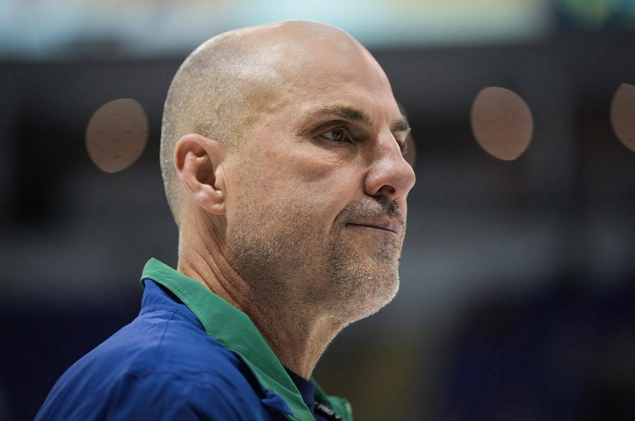 Vancouver Canucks head coach Rick Tocchet watches the opening day of the NHL hockey team’s training camp, in Victoria, Thursday, Sept. 21, 2023. THE CANADIAN PRESS/Darryl Dyck