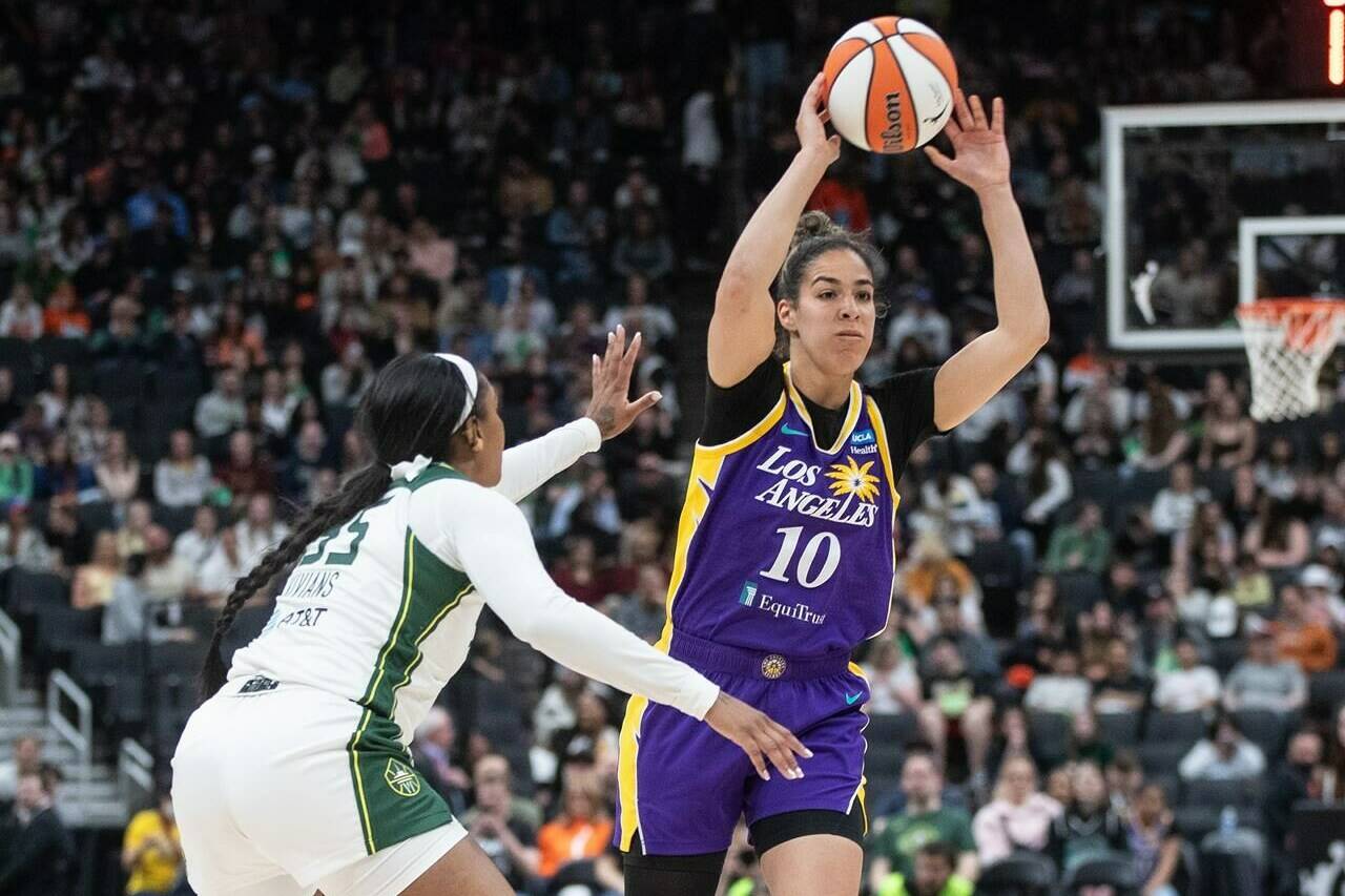 Los Angeles Sparks’ Kia Nurse (10) makes the pass as Seattle Storm’s Victoria Vivians (35) tries to block during second half WNBA preseason action in Edmonton on Saturday, May 4, 2024.THE CANADIAN PRESS/Jason Franson