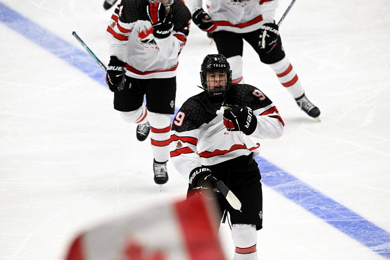 Gavin McKenna had a hat trick and added an assist as Canada rallied past the United States 6-4 on Sunday to win gold at the under-18 men’s world hockey championship. McKenna celebrates his 3-3 equalizer on power play during the 2024 IIHF ice hockey U18 world championships final match between the United States and Canada in Espoo, Finland, Sunday, May 5, 2024. THE CANADIAN PRESS/AP-Lehtikuva, Jussi Nukari, *MANDATORY CREDIT*
