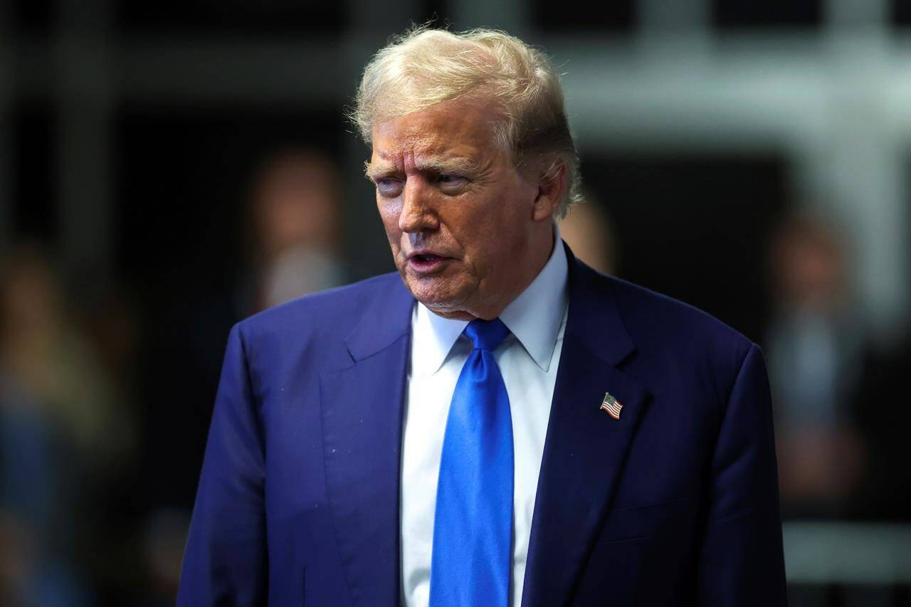 Former President Donald Trump speaks to media as he returns to his trial at the Manhattan Criminal Court, Friday, May 3, 2024, in New York. (Charly Triballeau/Pool Photo via AP)