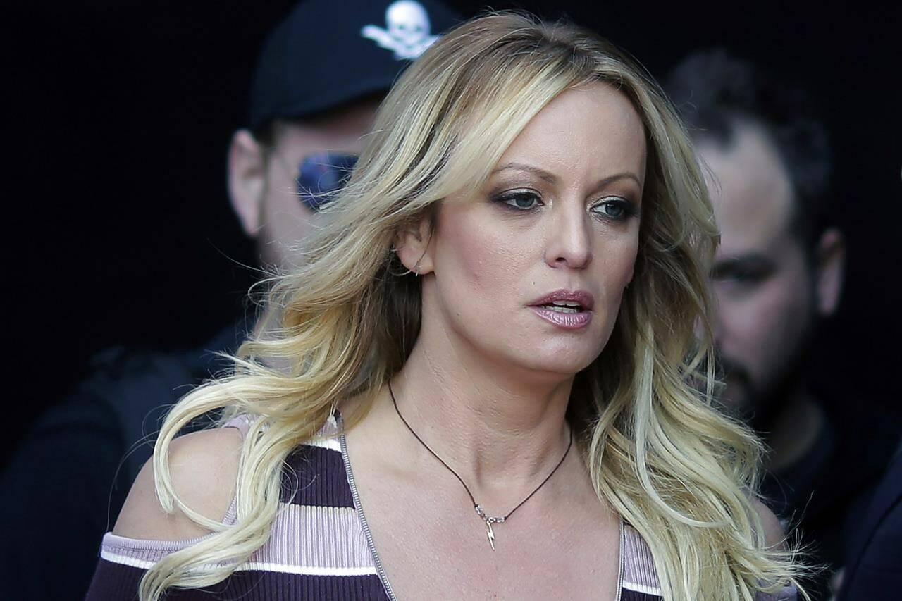 FILE - Stormy Daniels arrives at an event in Berlin, on Oct. 11, 2018. The porn actor received a $130,000 payment from Donald Trump’s former lawyer Michael Cohen as part of his hush-money efforts. Cohen paid Daniels to keep quiet about what she says was a sexual encounter with Trump years earlier. Trump denies having sex with Daniels. (AP Photo/Markus Schreiber, File)