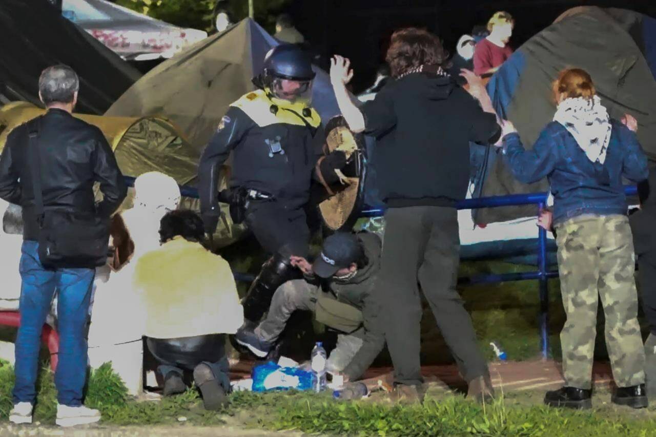 In this image taken from video Police arrests some 125 activists as they broke up a pro-Palestinian demonstration camp at the University of Amsterdam in Amsterdam, the Netherlands, Tuesday, May 7, 2024, as protests that have roiled campuses in the United States spread into Europe. (AP Photo InterVision)