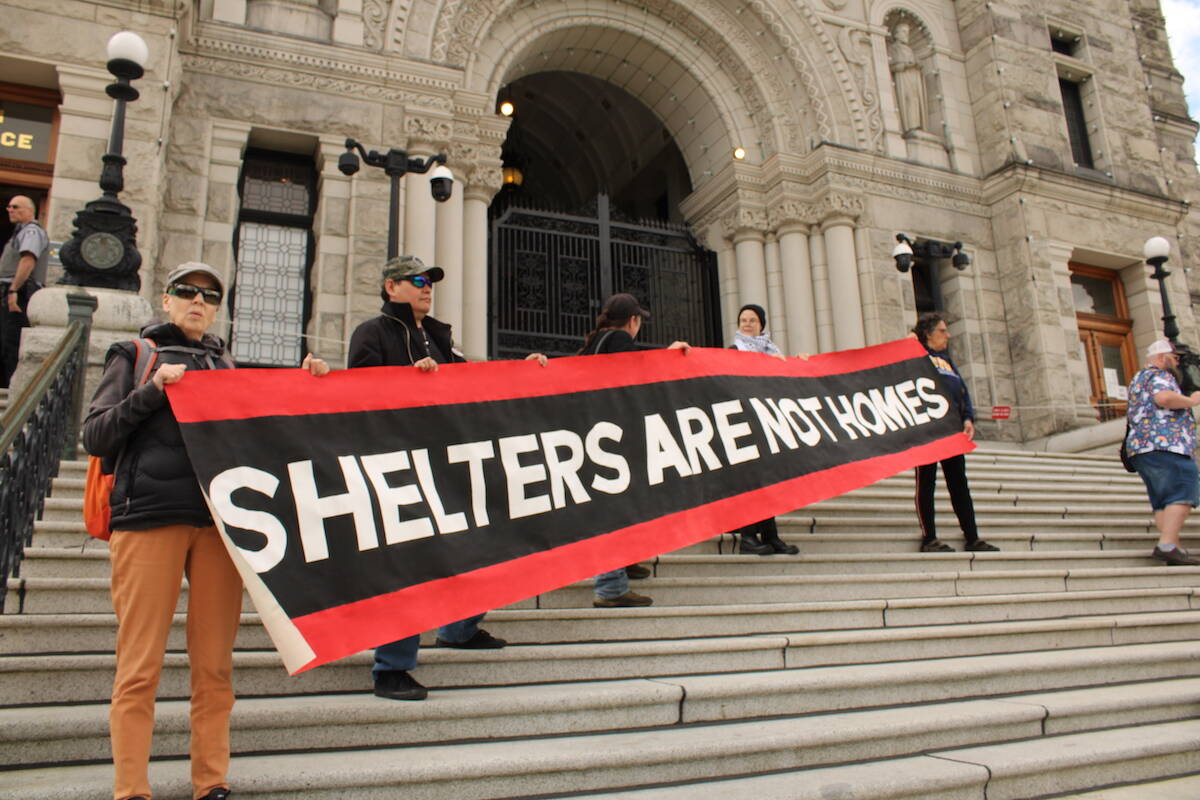 Members of the Housing Justice Project released their report on homelessness in Victoria at the B.C. legislature on May 7. (Jake Romphf/News Staff)