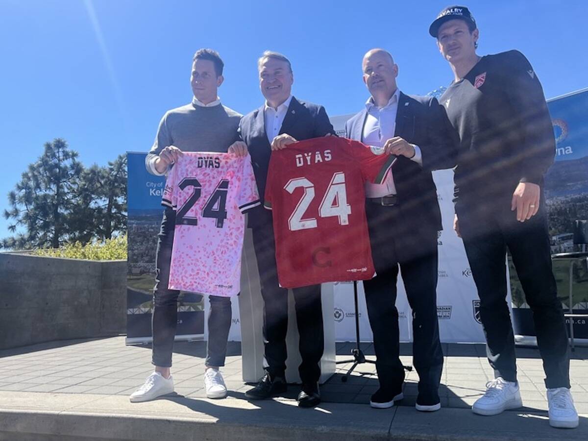 Kelowna Mayor Tom Dyas receiving a jersey from Vancouver FC representatives after a press conference on May 8. (Jacqueline Gelineau/Capital News)