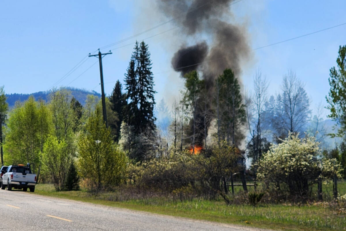 Thick smoke rises from a house fire along Highway 5 in Clearwater May 8. (Hettie Buck photo - Clearwater Times)