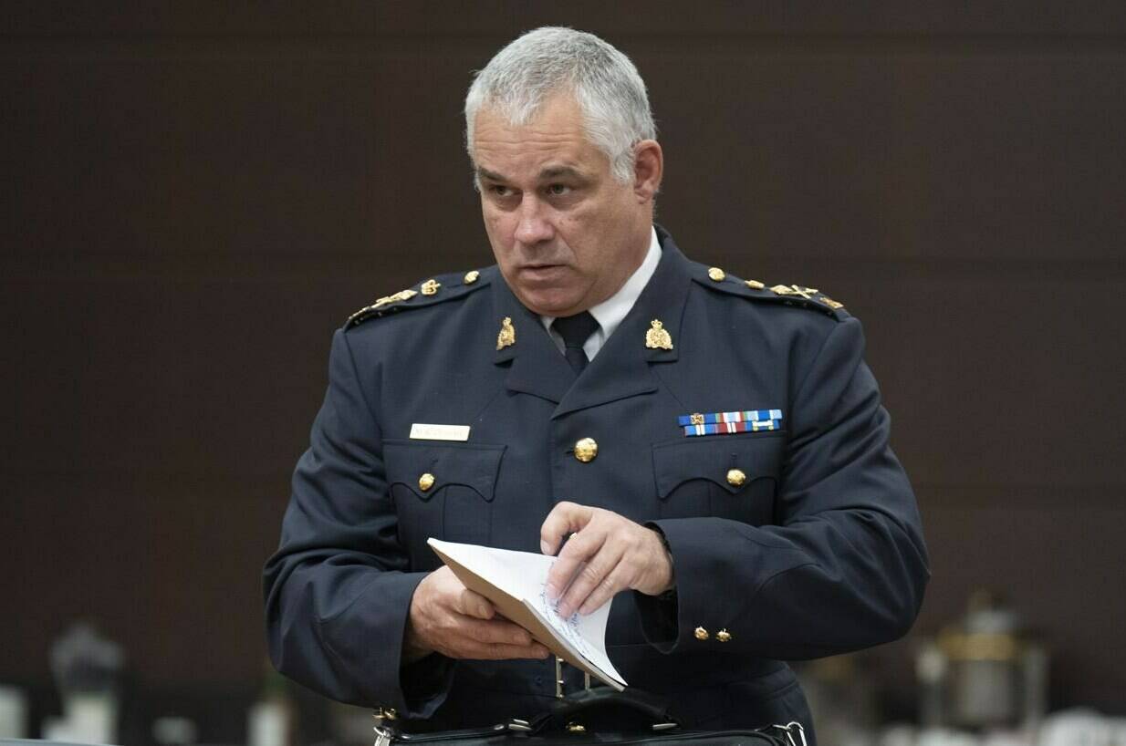 Acting RCMP Commissioner Mike Duheme waits to appear before the Procedure and House Affairs committee, in Ottawa, Tuesday, June 13, 2023. THE CANADIAN PRESS/Adrian Wyld