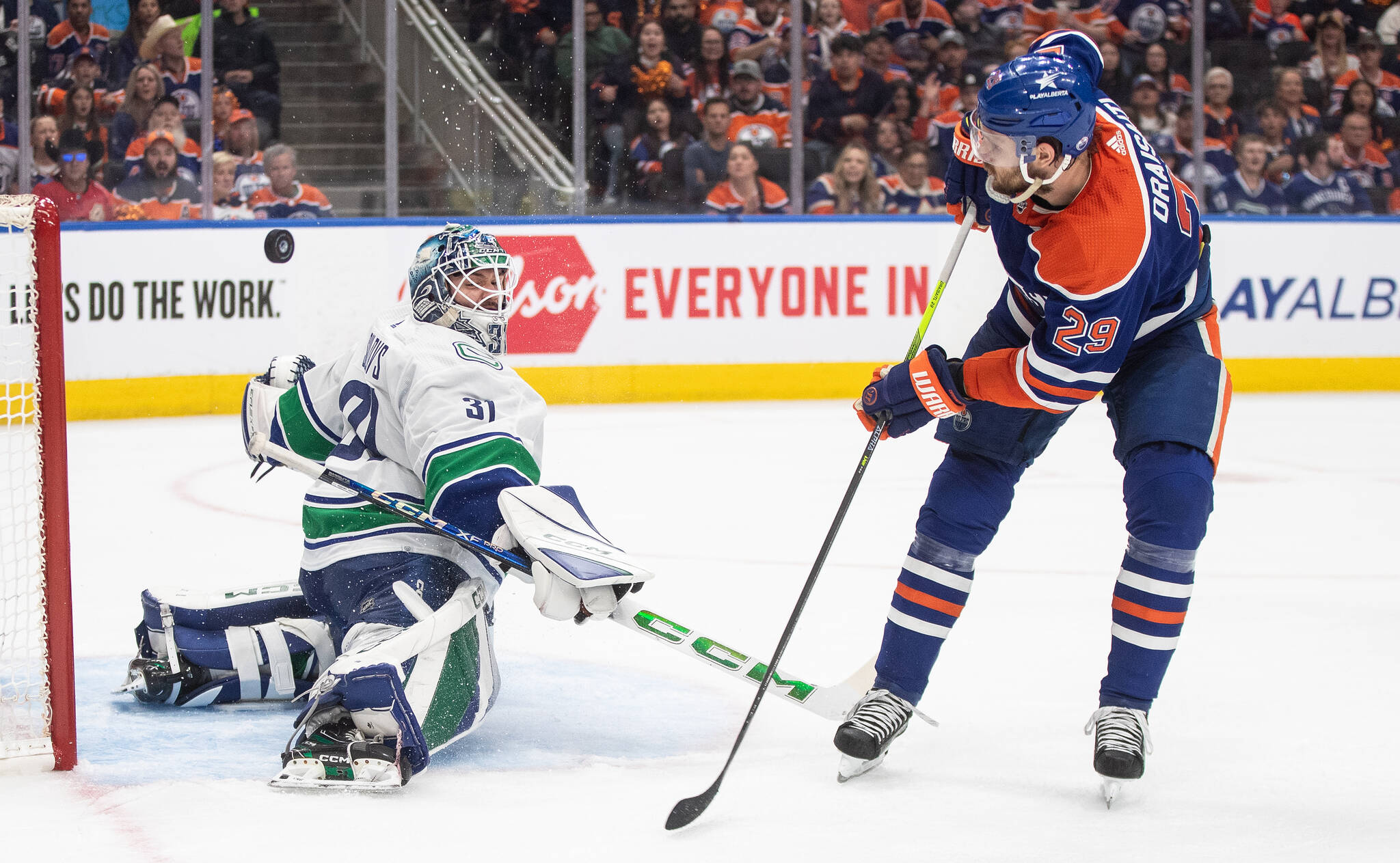 Vancouver Canucks goalie Arturs Silovs (31) makes the save on Edmonton Oilers’ Leon Draisaitl (29) during second period second-round NHL playoff action in Edmonton, Sunday, May 12, 2024. THE CANADIAN PRESS/Jason Franson
