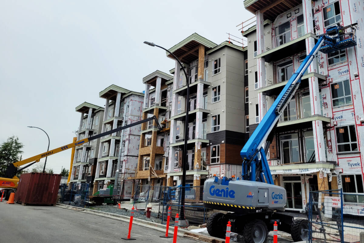 Construction workers with lifts at the site of the 330-unit Inspire condominium development in downtown Maple Ridge. New figures from Statistics Canada show the value of residential building permits in B.C. dropped by 12.2 per cent in March 2024 compared to February 2024.	Compared to March 2023, the value of residential permits dropped by 14.3 per cent. (Neil Corbett/The News)