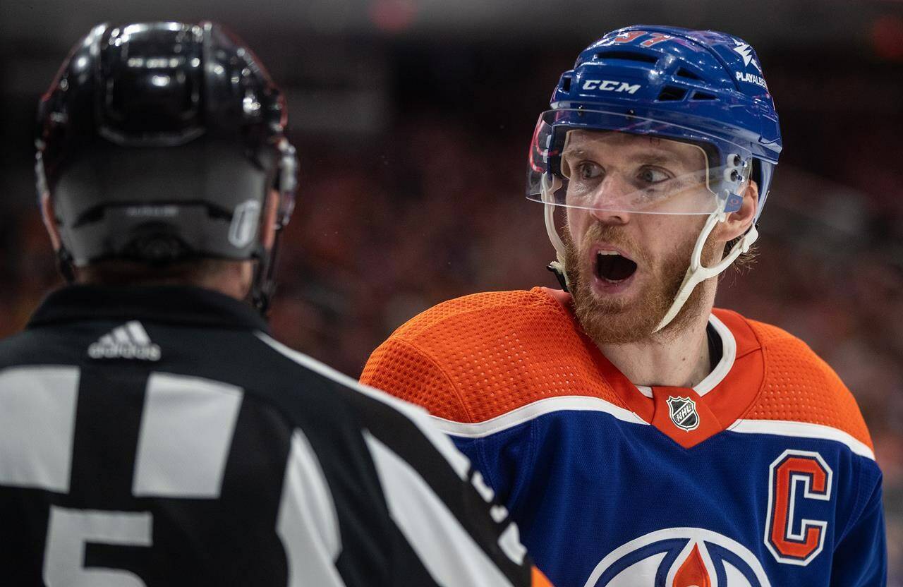 Edmonton Oilers’ Connor McDavid (97) argues with the referee during second period of second-round NHL playoff action against the Vancouver Canucks, in Edmonton, Sunday, May 12, 2024. THE CANADIAN PRESS/Jason Franson