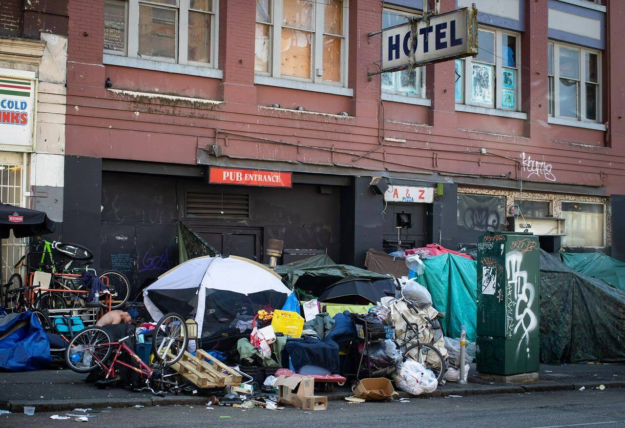 Tents line the sidewalk on East Hastings Street in the Downtown Eastside of Vancouver, on Thursday, July 28, 2022. THE CANADIAN PRESS/Darryl Dyck