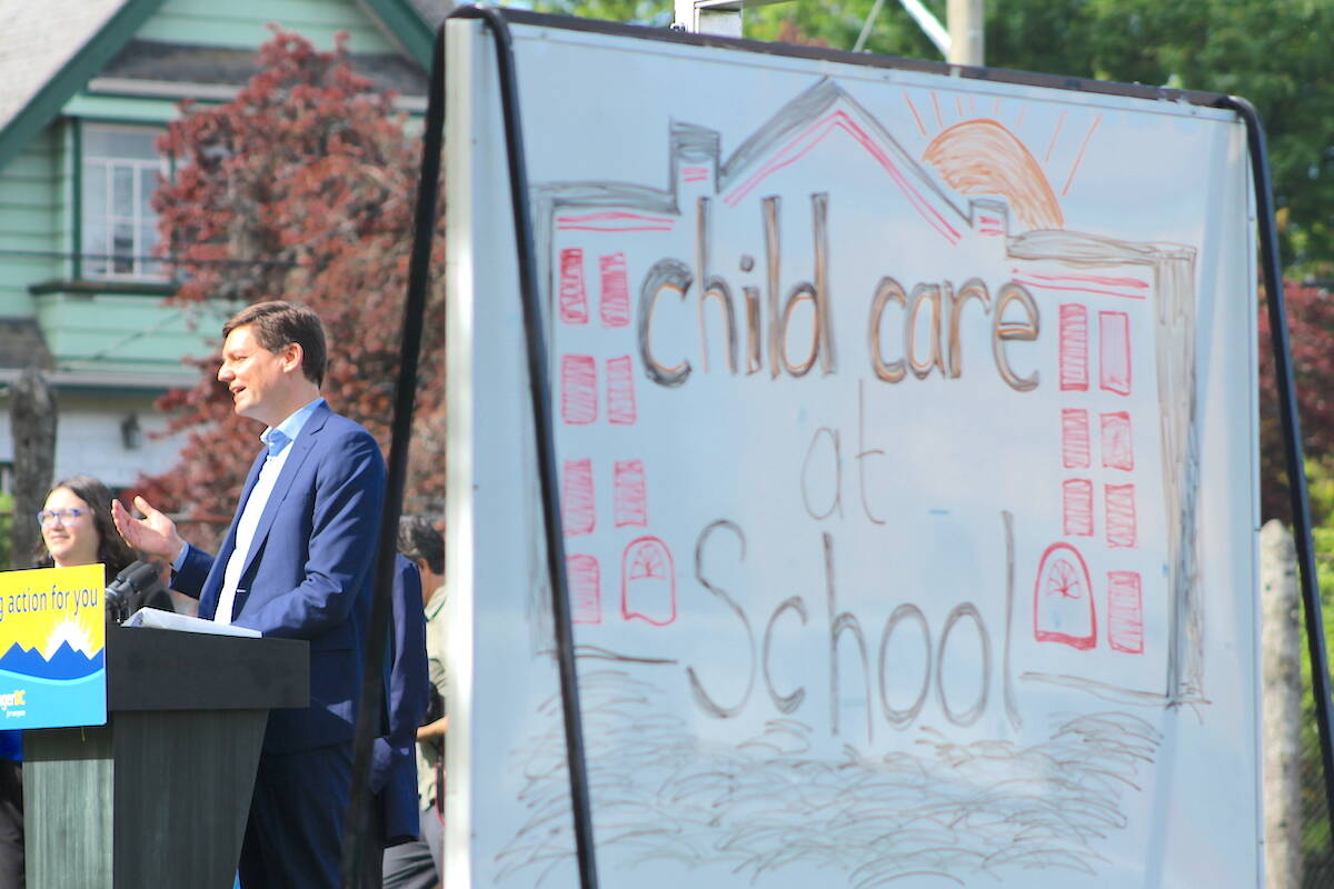 Premier David Eby speaks at a May 14 announcement in Victoria about integrating child care in existing school sites. (Jake Romphf/News Staff)