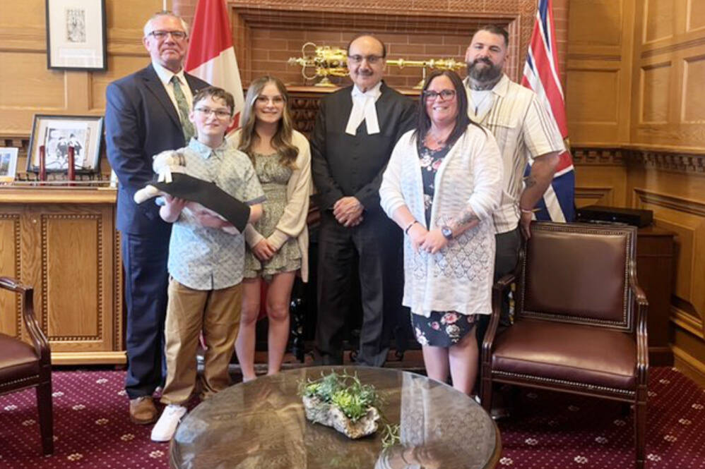 Cariboo-Chilcotin MLA Lorne Doerkson (right) brought the family of Carter Vigh including his siblings Daxton Vigh, Cadence Vigh and his parents Amber Vigh and James Vigh to Victoria on Monday, May 13 to meet members of the B.C. parliament including speaker of the house Raj Chouhan (centre). Doerkson wanted the Vigh family there as he introduced Carter’s Law, an amendment to the B.C. Wildfire Act that is designed to protect people with breathing problems from wildfire smoke. Carter passed away last summer at the age of nine due to an Asthma attack caused by smoke inhalation. (Photo submitted)
