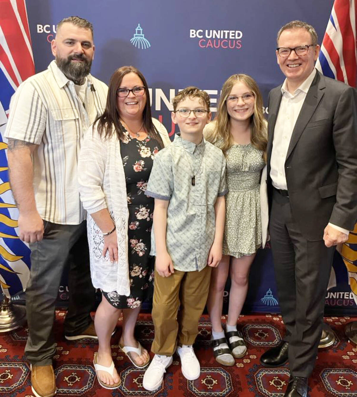 100 Mile House residents James Vigh (left), Amber Vigh, Daxton Vigh and Cadence Vigh met B.C. United leader Kevin Falcon on Monday, May 13 in Victoria. The Vighs were in Victoria to attend the proposal of Carter’s Law, a law named for Carter Vigh who passed away suddenly at the age of nine last summer from an asthma attack caused by wildfire smoke inhalation. (Photo submitted)