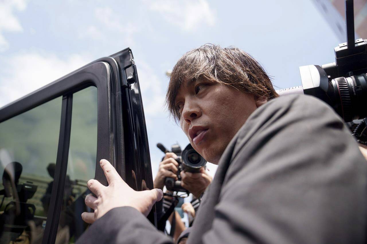 Ippei Mizuhara, the former longtime interpreter for the Los Angeles Dodgers baseball star Shohei Ohtani, gets into a vehicle following his arraignment at federal court, Tuesday, May 14, 2024 in Los Angeles. Mizuhara pleaded not guilty Tuesday to bank and tax fraud, a formality ahead of a plea deal he’s negotiated with federal prosecutors in a wide-ranging sports betting case. (AP Photo/Eric Thayer)